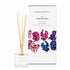 A sweet pea scented reed diffuser from Home County Co. The vegan friendly reed diffuser is shown next to the eco friendly reed diffuser box packaging.