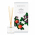 An apple and fresh fig scented reed diffuser from Home County Co. The vegan friendly reed diffuser is shown next to the eco friendly reed diffuser box packaging.