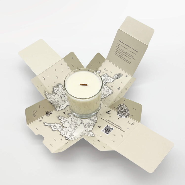 An open Home County Co. candle box shows map of the UK inside with soy wax wooden wick candle