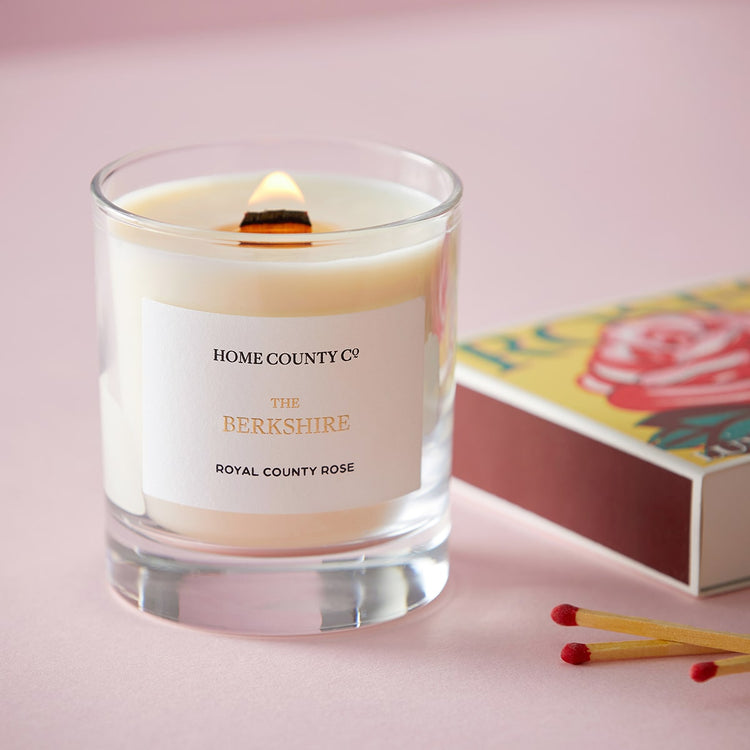 Home County Co. Berkshire rose scented candle shown with box of matches