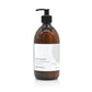 A 500ml coastal sea salt and wood sage hand and body lotion from the Home County Co. is shown in its eco-friendly amber glass bottle