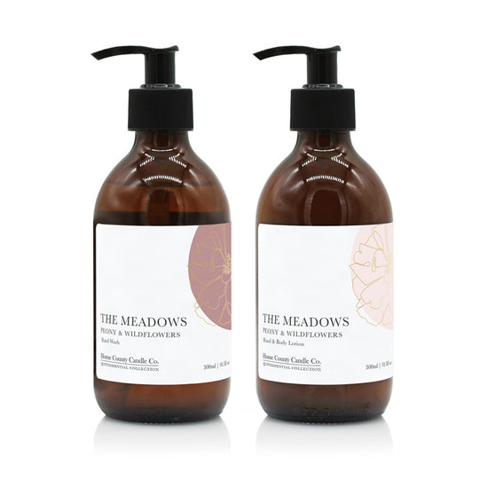 A 300ml floral peony and wildflowers scented hand wash and lotion duo from the Home County Co. is shown in eco-friendly amber glass bottles