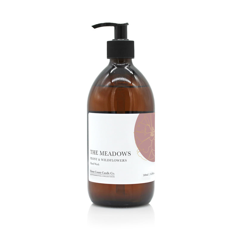A 500ml floral peony and wildflowers scented liquid hand wash from the Home County Co. is shown in its eco-friendly amber glass bottle