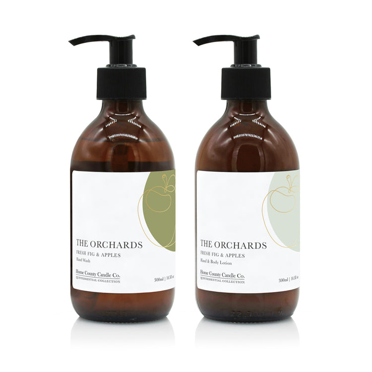 A 300ml fresh fig and green apples scented hand wash and lotion duo from the Home County Co. is shown in eco-friendly amber glass bottles