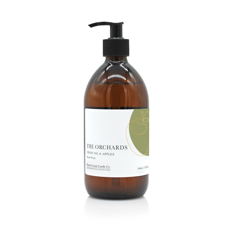 A 500ml fresh fig and apples scented liquid hand wash from the Home County Co. is shown in its eco-friendly amber glass bottle